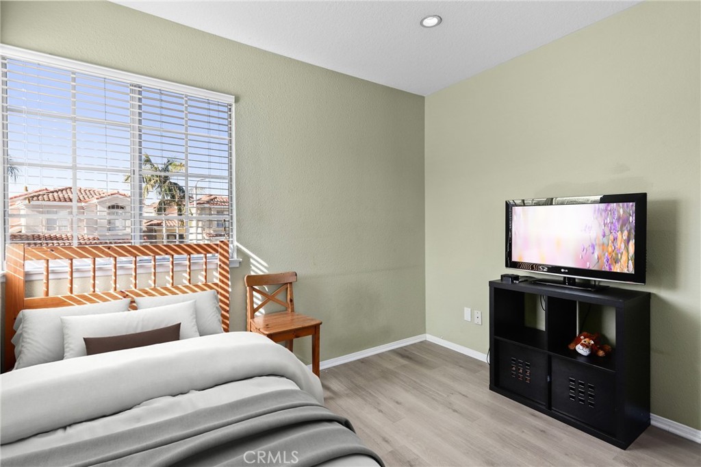 2 Bormes Irvine, CA 92614 - Photo 34 of 69 a living room with furniture a flat screen tv and a fireplace