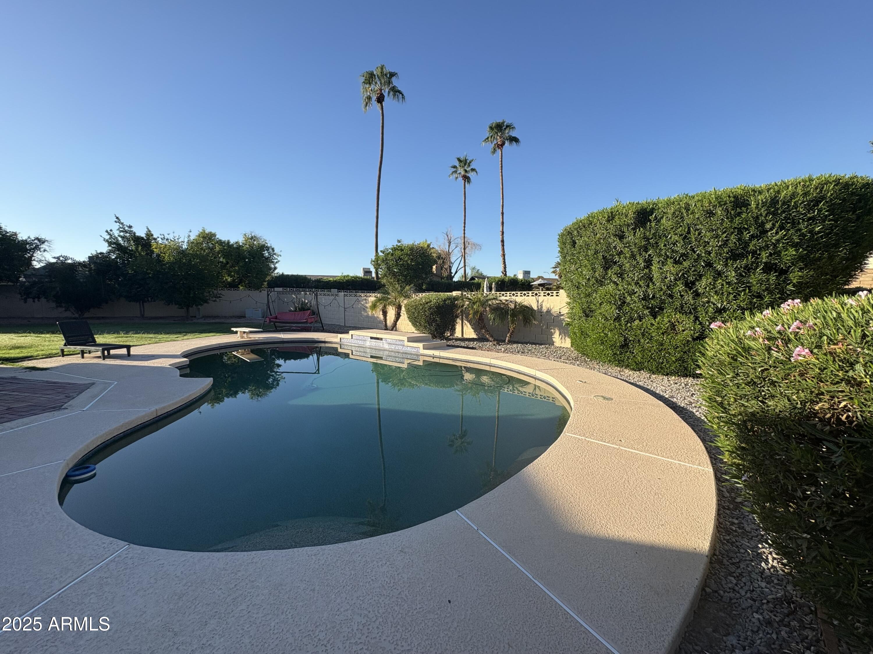 5021 West Echo Lane Glendale, AZ 85302 - Photo 1 of 7 a view of a swimming pool with a chairs