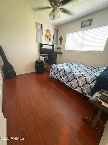 a bedroom with bed and window