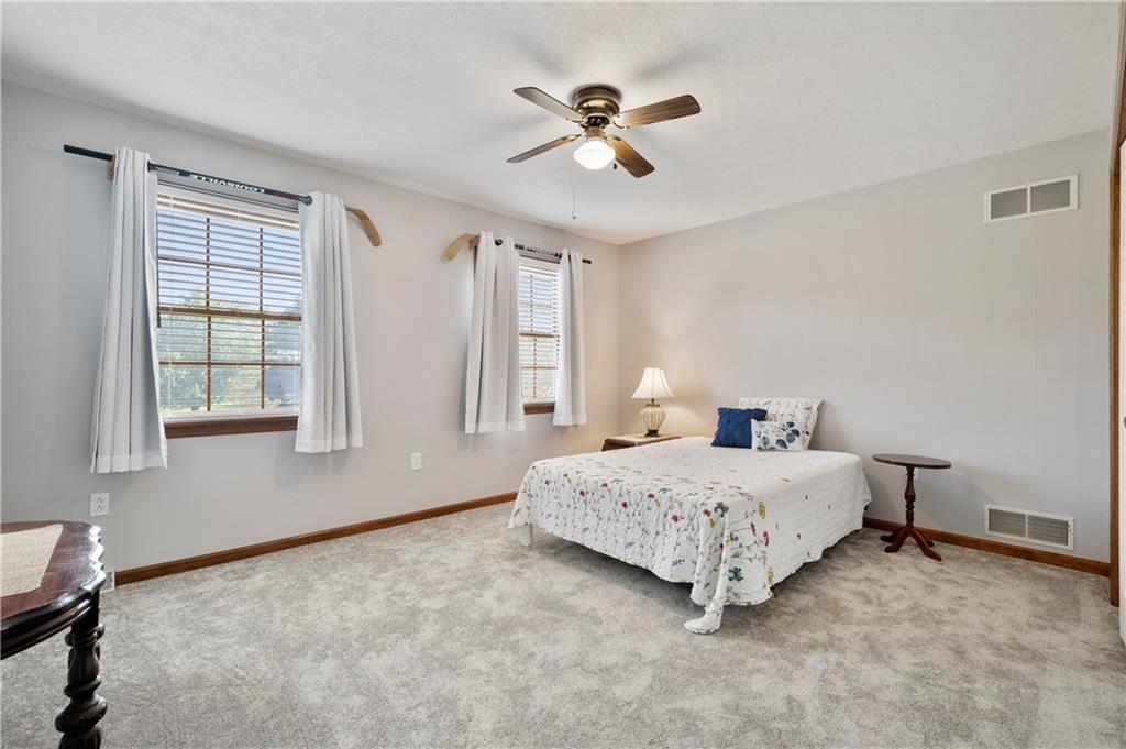 106 Good Luck Lane Mars, PA 16046 - Photo 25 of 33 a bedroom with a bed chandelier and a window
