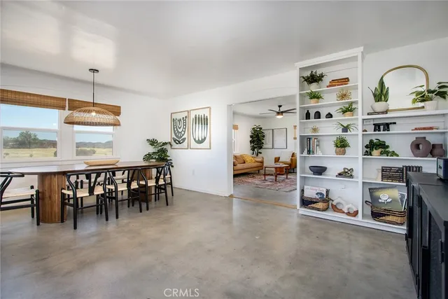 a view of a livingroom with furniture and window