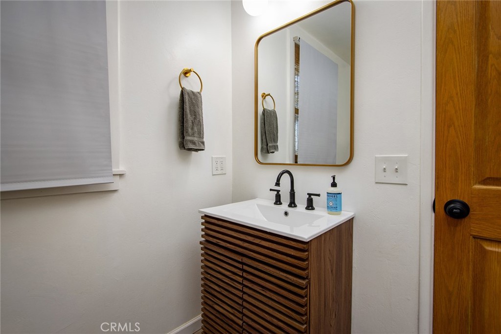 64975 Sun Oro Road Joshua Tree, CA 92252 - Photo 34 of 52 a bathroom with a sink and a mirror