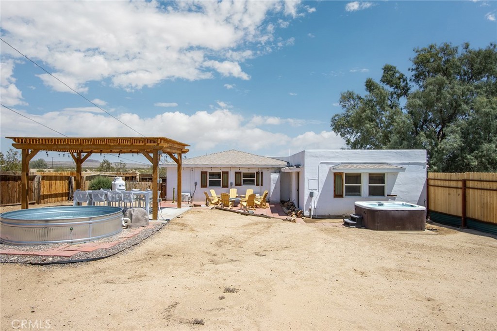 64975 Sun Oro Road Joshua Tree, CA 92252 - Photo 44 of 52 a view of a house with a swimming pool