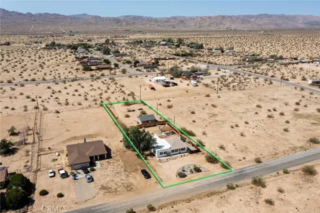 an aerial view of residential house and outdoor space