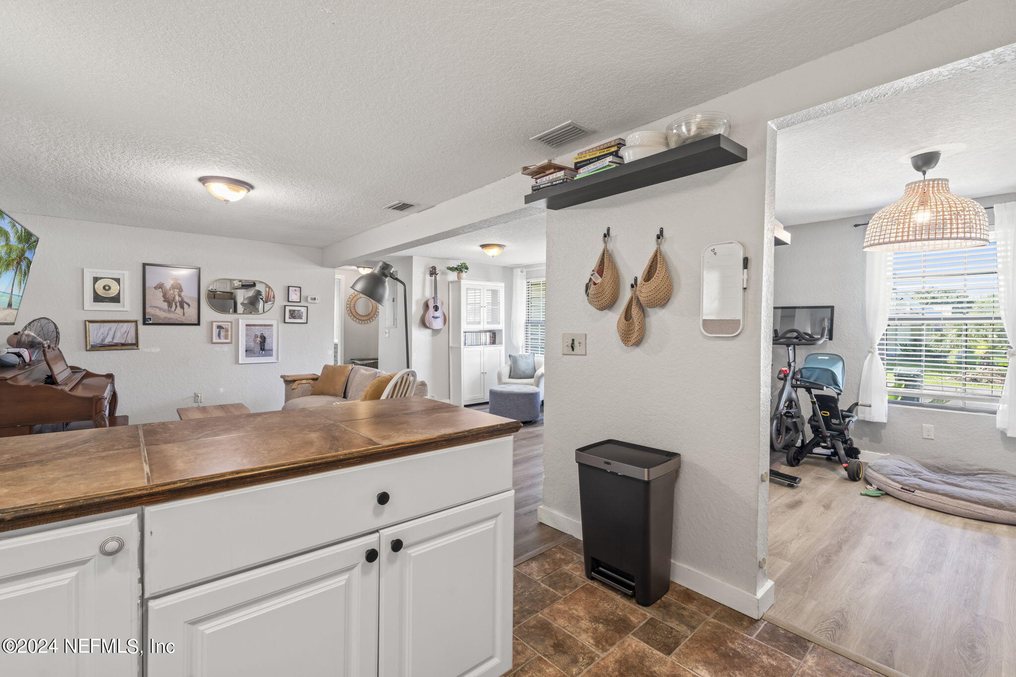 13548 Chauny Road Jacksonville, FL 32246 - Photo 15 of 55 a living room with granite countertop furniture and a flat screen tv