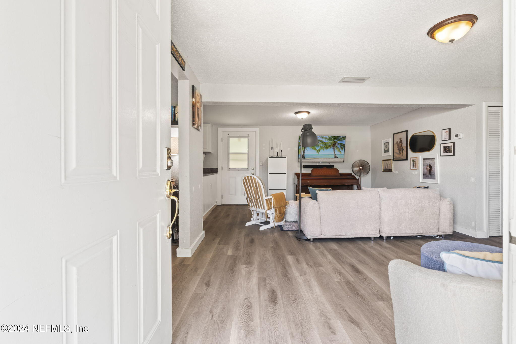 13548 Chauny Road Jacksonville, FL 32246 - Photo 3 of 55 a living room with furniture and a wooden floor