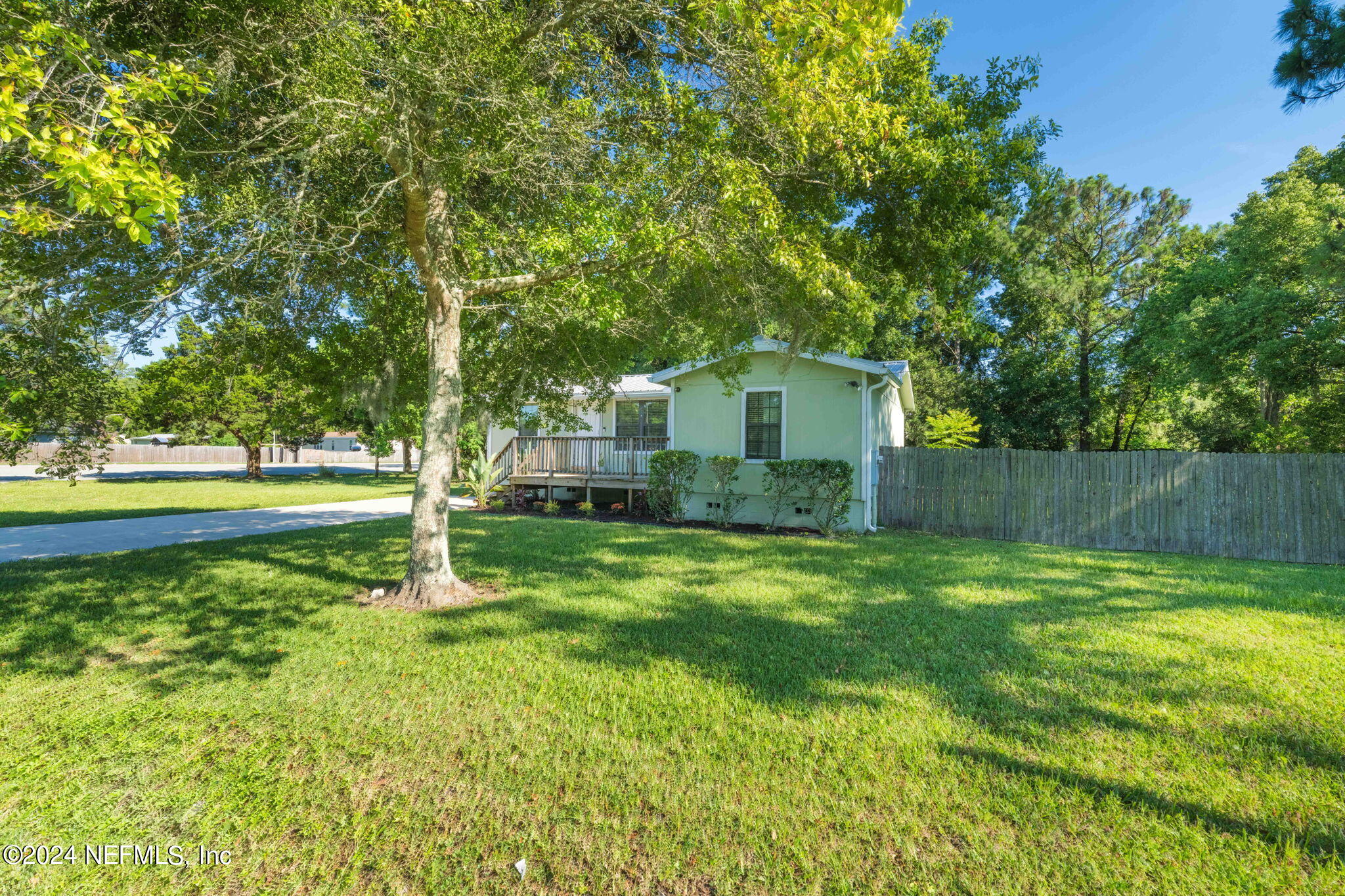 13548 Chauny Road Jacksonville, FL 32246 - Photo 34 of 55 a house view with a play ground in front of it