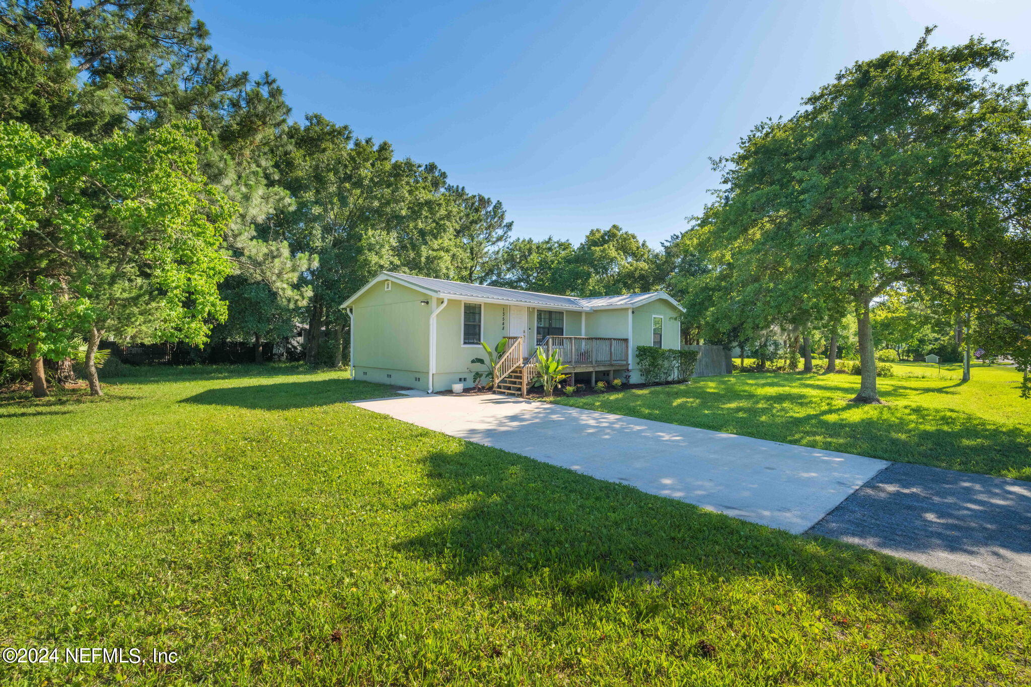 13548 Chauny Road Jacksonville, FL 32246 - Photo 36 of 55 a view of a house with a yard