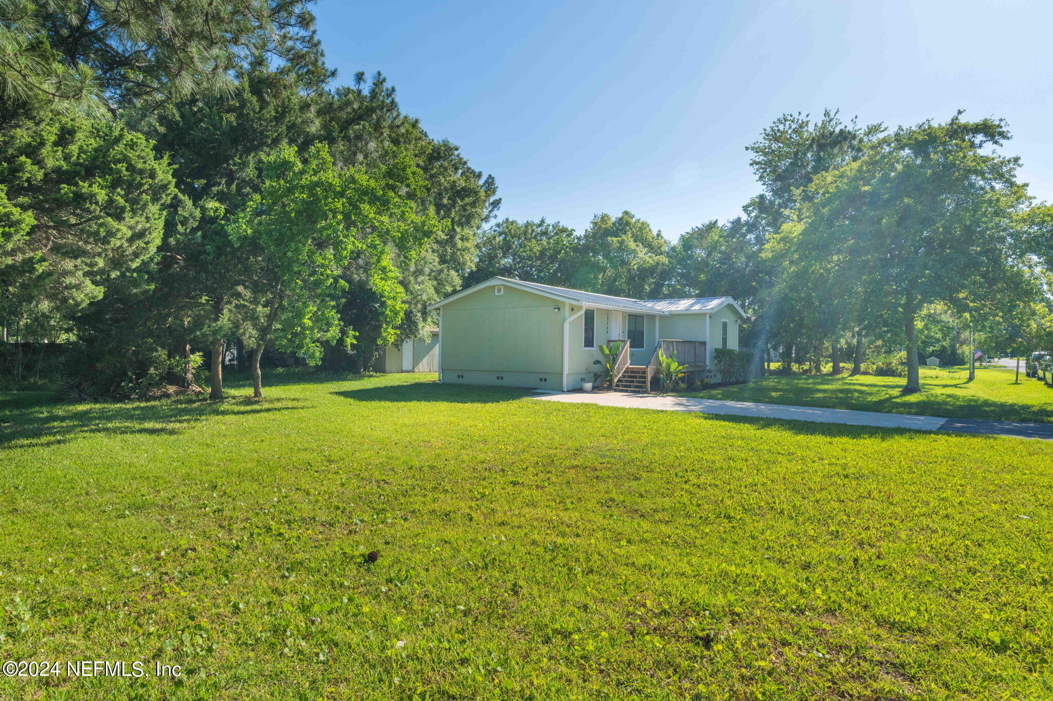13548 Chauny Road Jacksonville, FL 32246 - Photo 37 of 55 a house view with swimming pool in front of it