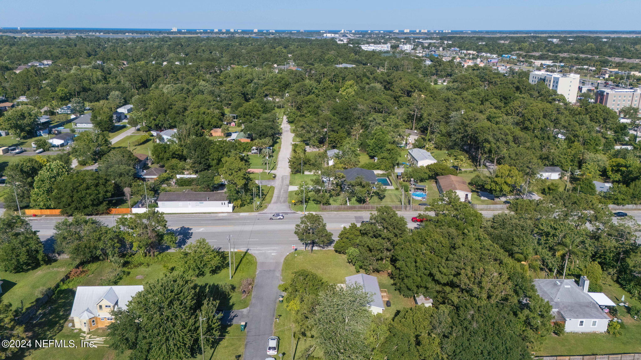 13548 Chauny Road Jacksonville, FL 32246 - Photo 43 of 55 an aerial view of residential houses with outdoor space and trees