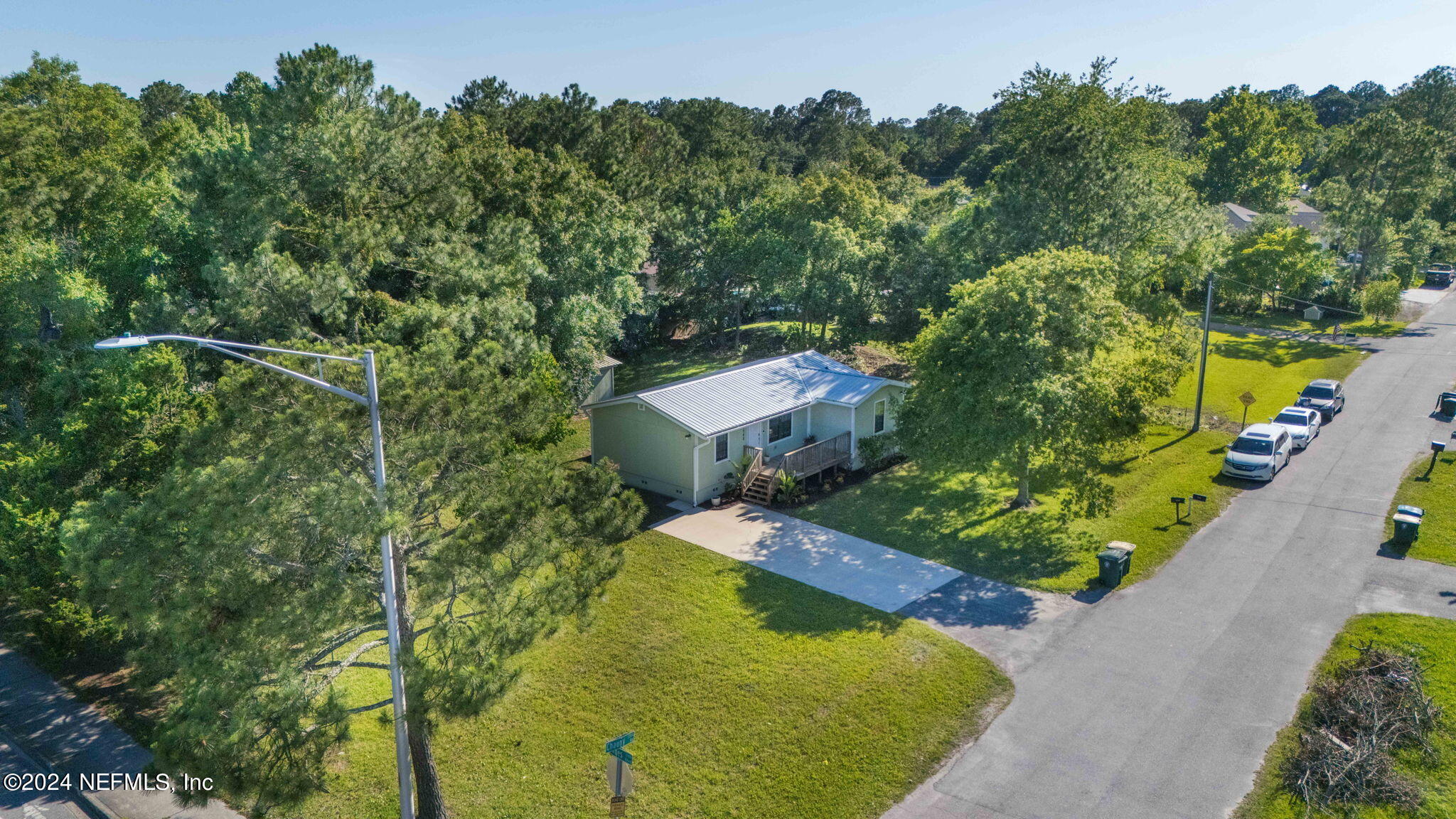13548 Chauny Road Jacksonville, FL 32246 - Photo 52 of 55 an aerial view of a house with swimming pool and garden
