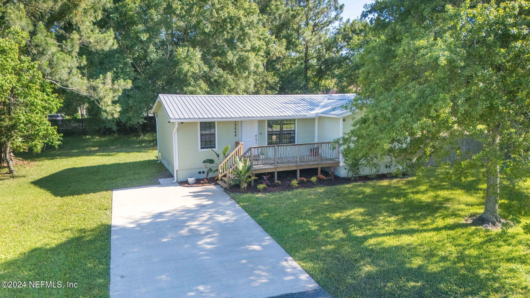 13548 Chauny Road Jacksonville, FL 32246 - Photo 53 of 55 a view of a house with a yard porch and sitting area