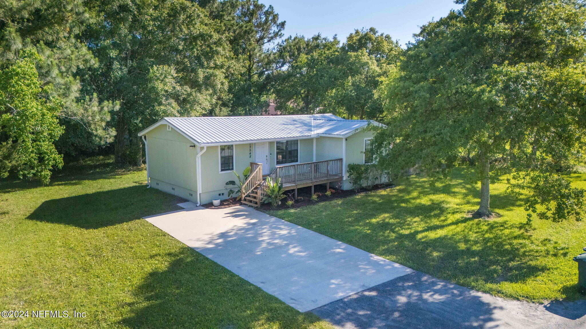 13548 Chauny Road Jacksonville, FL 32246 - Photo 54 of 55 a view of a house with a yard