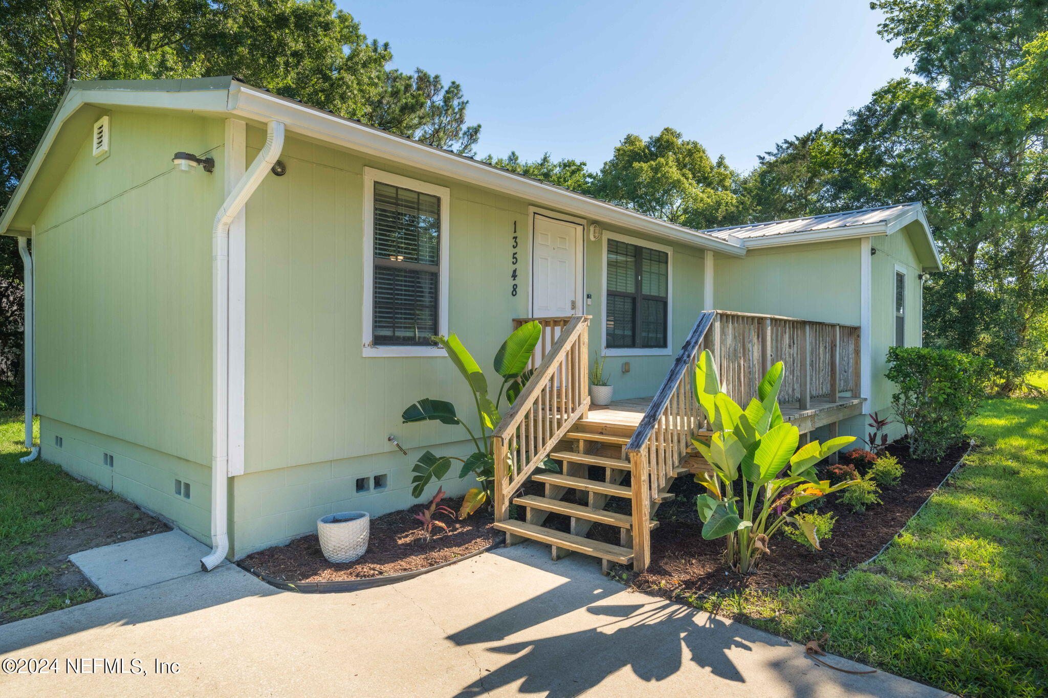 13548 Chauny Road Jacksonville, FL 32246 - Photo 55 of 55 a view of a house with patio