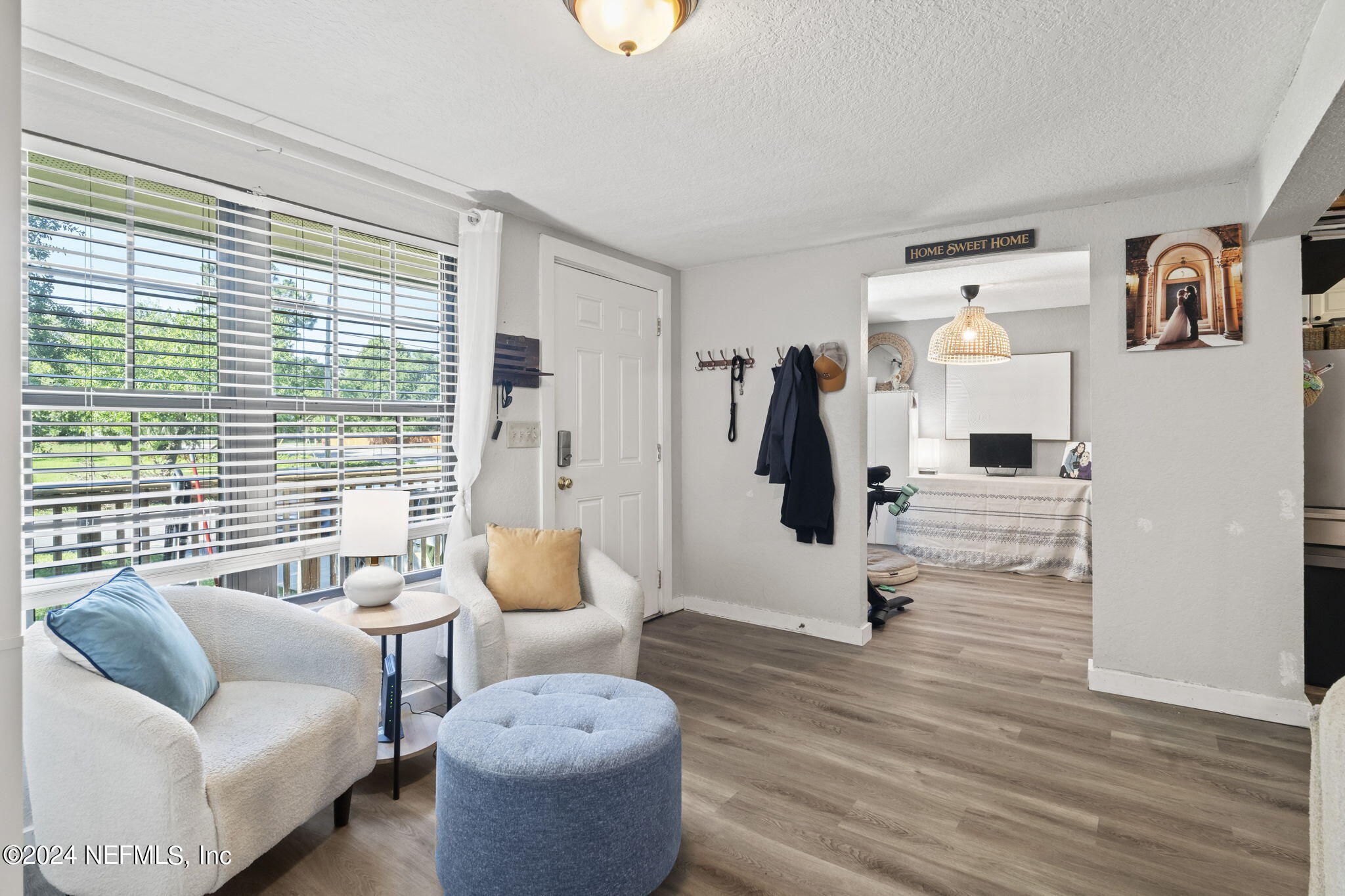 13548 Chauny Road Jacksonville, FL 32246 - Photo 6 of 55 a living room with furniture and a large window
