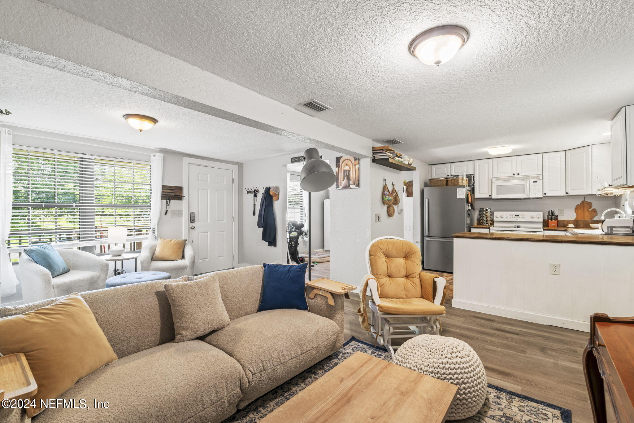 13548 Chauny Road Jacksonville, FL 32246 - Photo 10 of 55 a living room with furniture and kitchen view