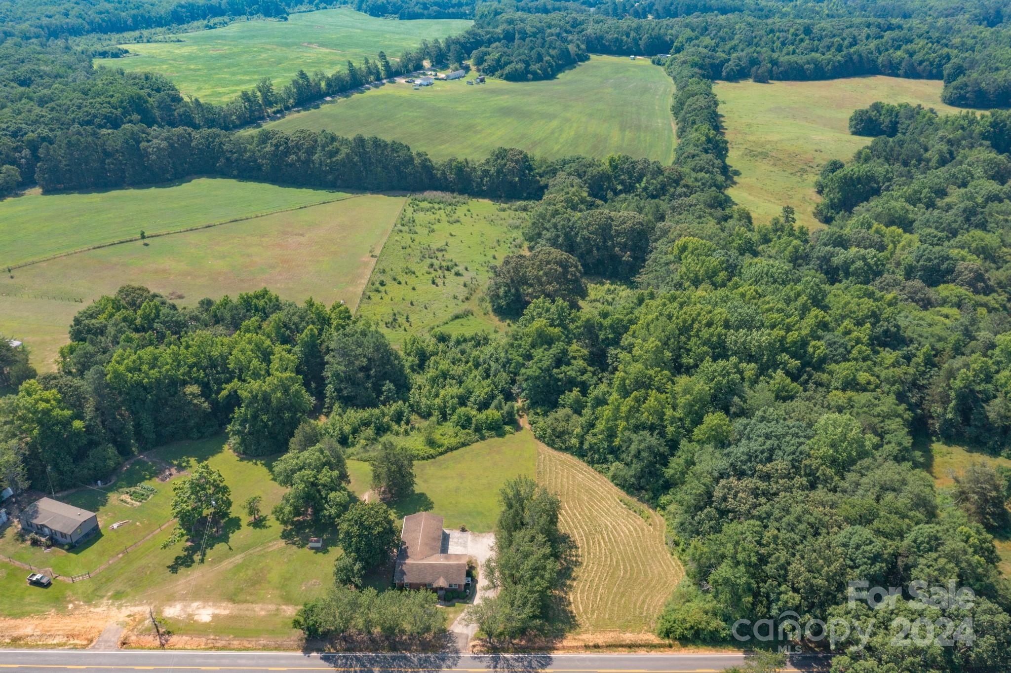 3064 Armenia Road Chester, SC 29706 - Photo 12 of 19 an aerial view of a house with a yard and lake view