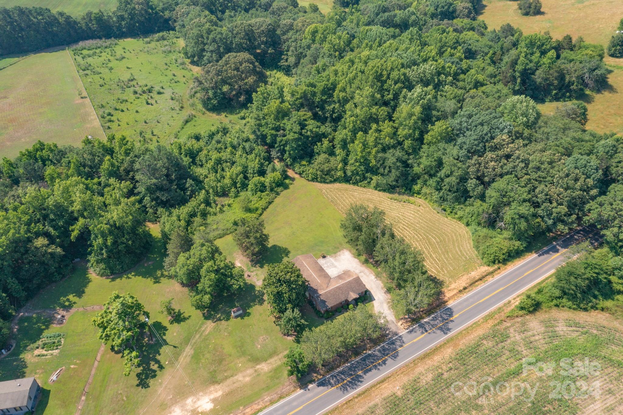 3064 Armenia Road Chester, SC 29706 - Photo 13 of 19 an aerial view of a house with a yard and lake view