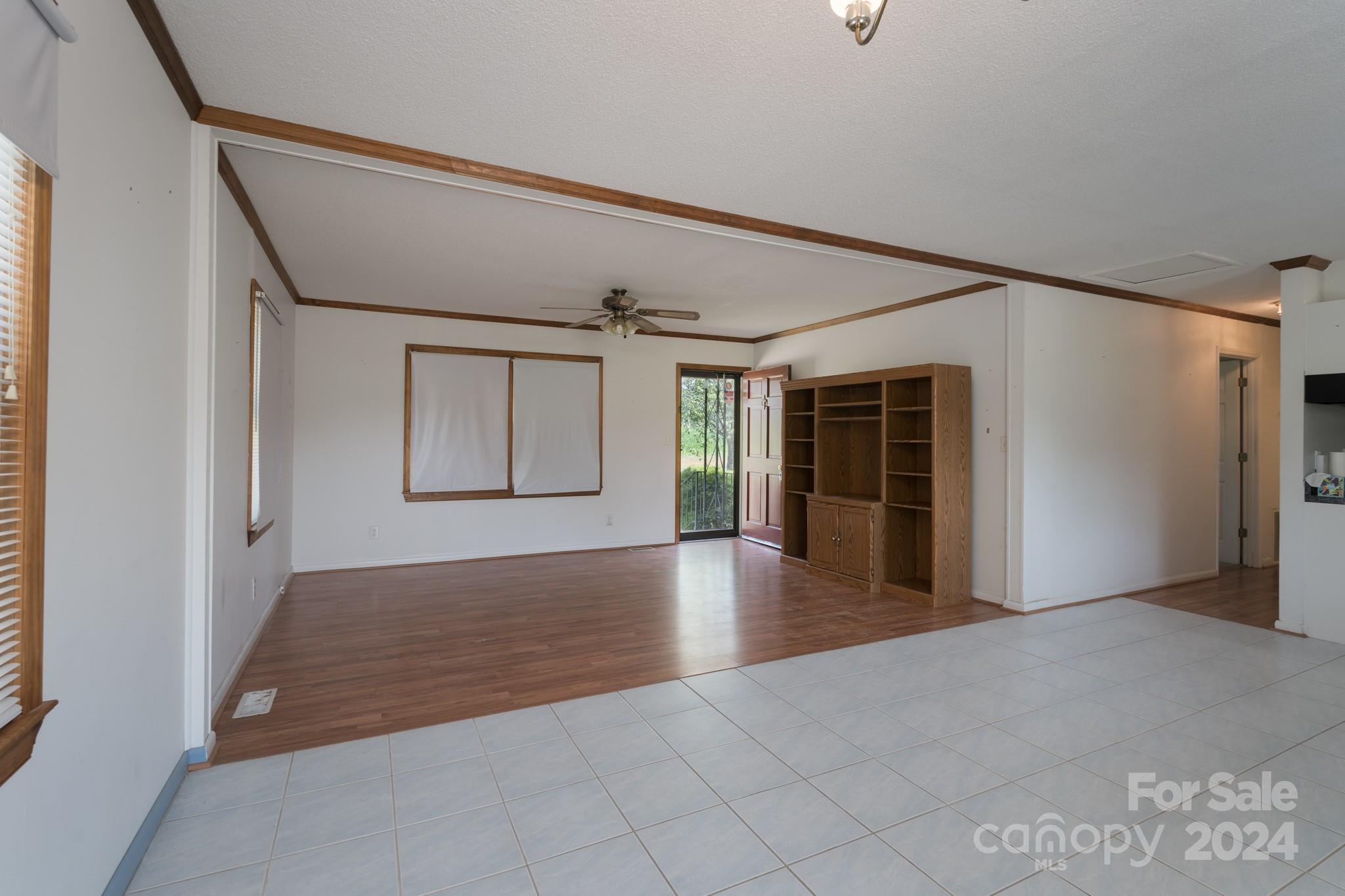 3064 Armenia Road Chester, SC 29706 - Photo 4 of 19 a view of a big room with wooden floor and windows