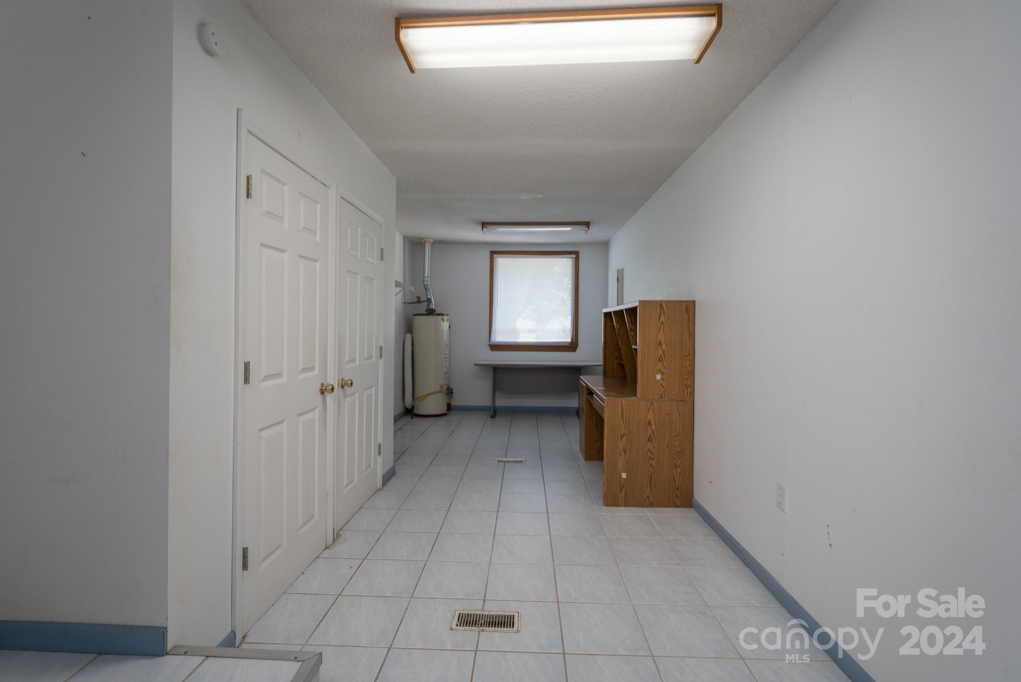 3064 Armenia Road Chester, SC 29706 - Photo 6 of 19 a view of a hallway and closet with wooden floor