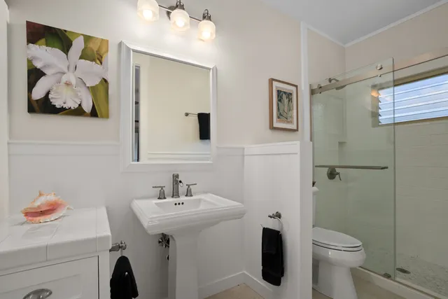 a bathroom with a sink toilet and vanity