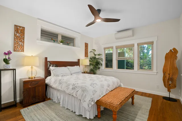 a bed room with a bed window and a chair