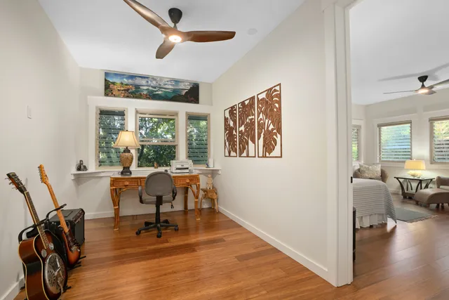 a view of a livingroom with furniture window and wooden floor