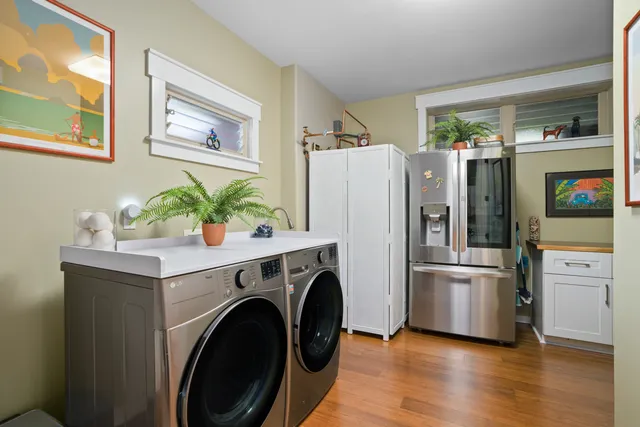 a kitchen with stainless steel appliances a refrigerator and a stove