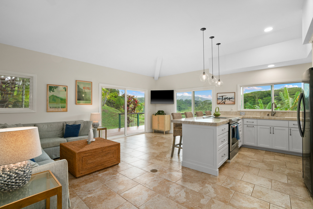 3275 Kalihiwai Road, Unit A & B Princeville, HI 96722 - Photo 28 of 30 a living room with furniture and a large window
