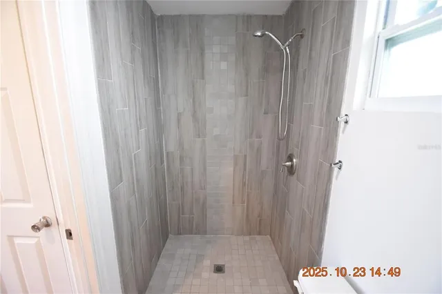 a bathroom with a sink vanity mirror and toilet