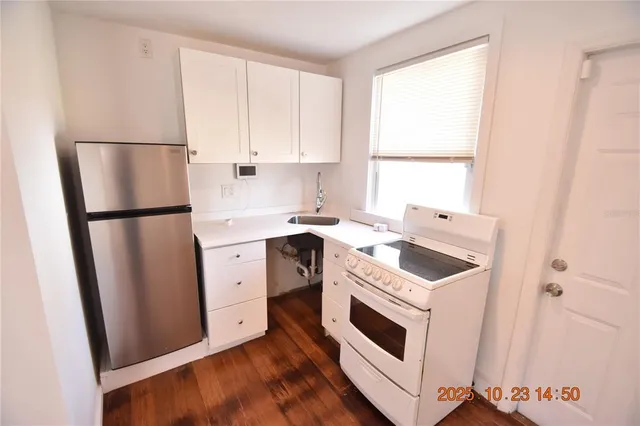 a view of a refrigerator in kitchen and a refrigerator