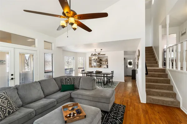 a bed room with a bed and a chair