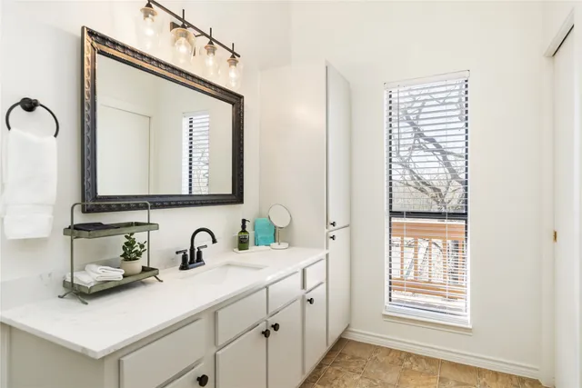a spacious bathroom with a shower and a sink