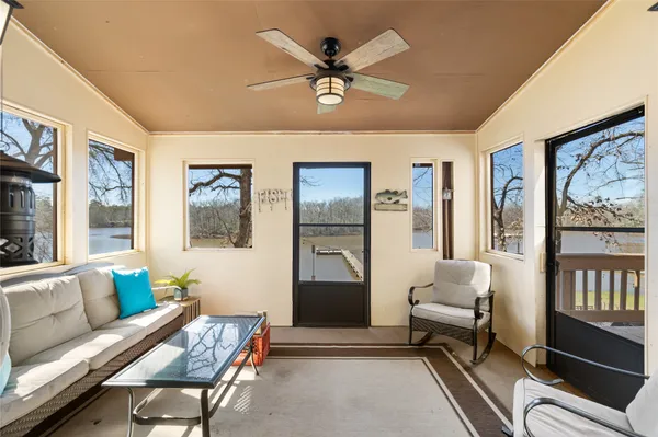 a view of a chair and tables in the balcony