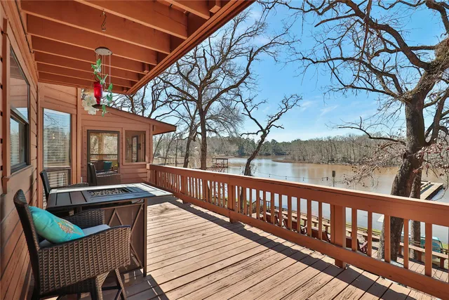 a view of a patio with a table and chairs