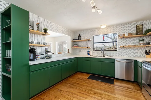 a view of a dining room with furniture wooden floor and chandelier