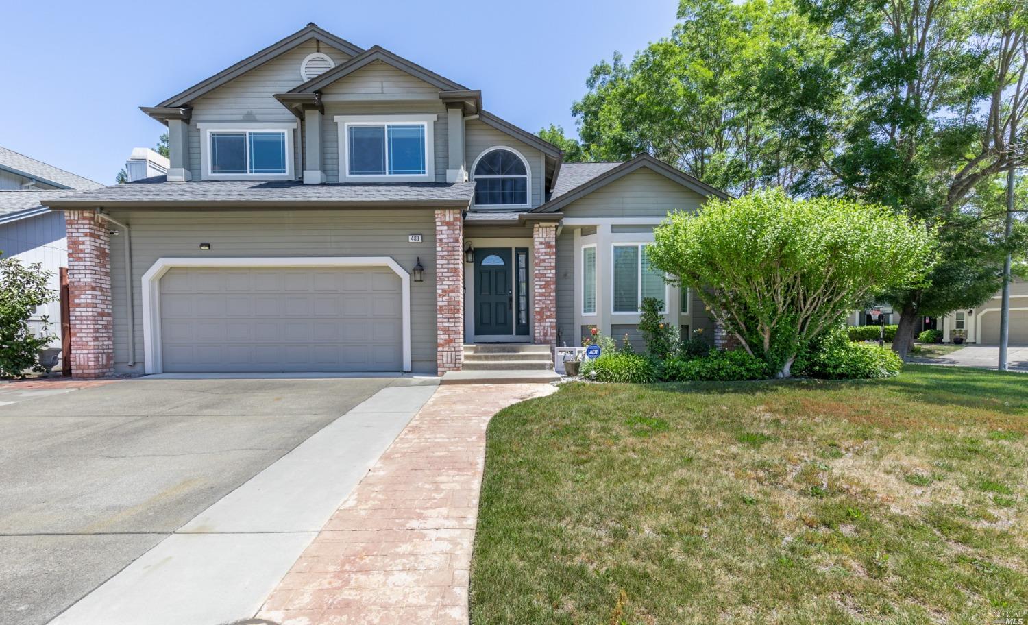 483 Noonan Ranch Lane Santa Rosa, CA 95403 - Photo 1 of 1 a front view of a house with a garden and trees