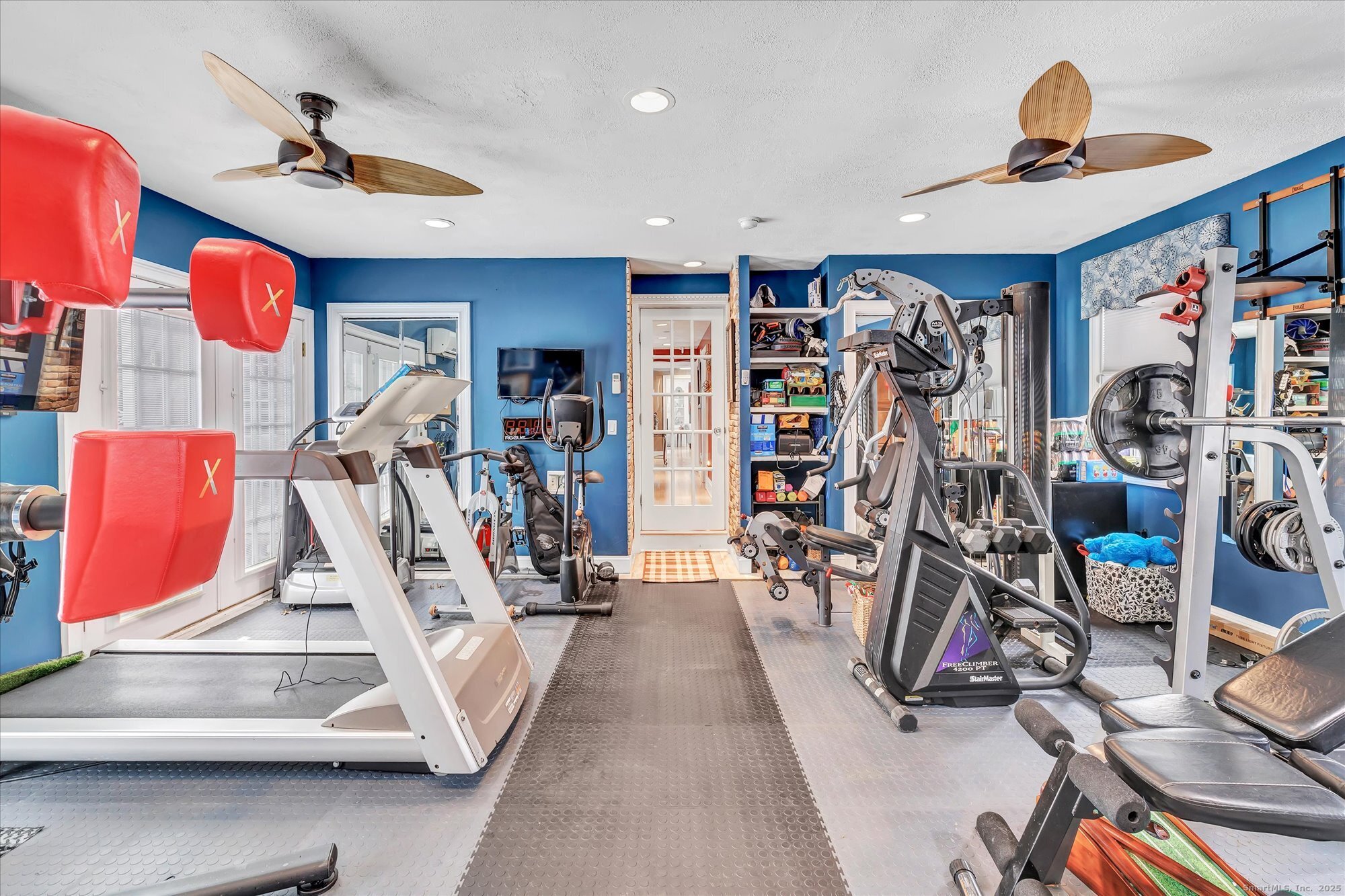 830 Bayberry Lane Orange, CT 06477 - Photo 12 of 40 a view of a room with gym equipment