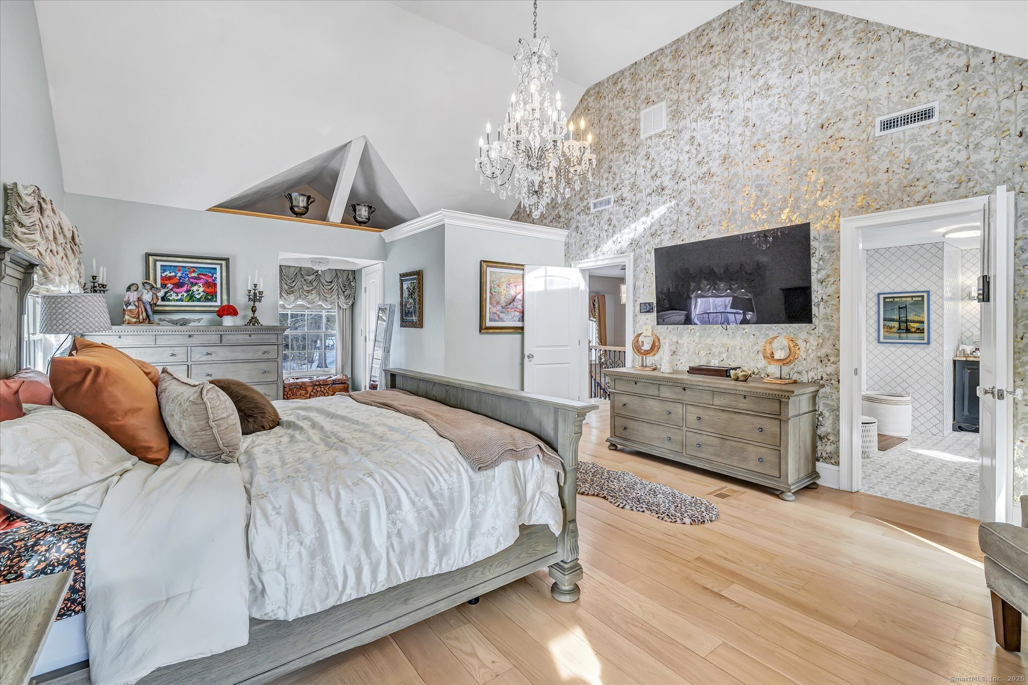 830 Bayberry Lane Orange, CT 06477 - Photo 14 of 40 a bedroom with a bed and flat screen tv