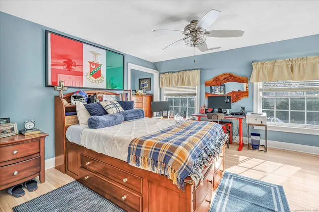 a bed room with a bed and a chandelier