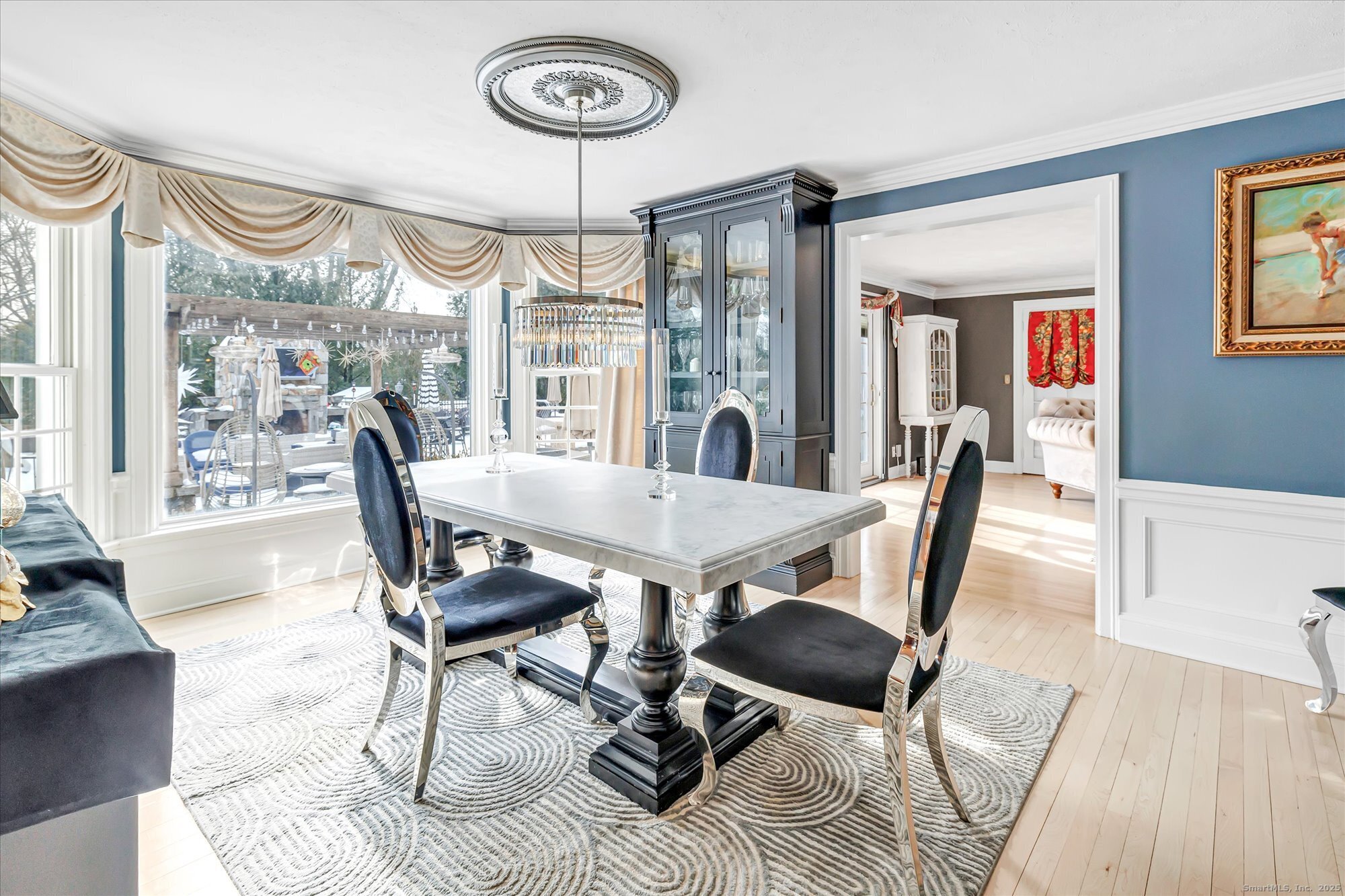 830 Bayberry Lane Orange, CT 06477 - Photo 9 of 40 a view of a dining room with furniture window and wooden floor