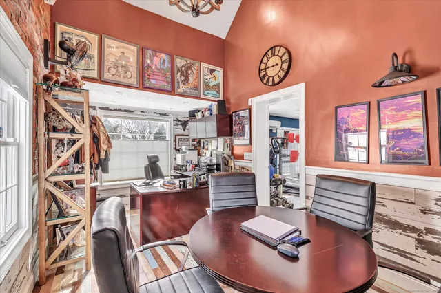 a living room with fireplace furniture and a wooden floor