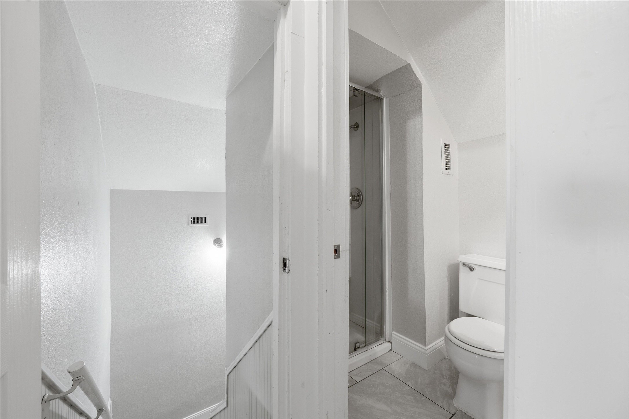 803 North 3rd Street Temple, TX 76501 - Photo 17 of 22 a bathroom with a granite countertop toilet and a shower