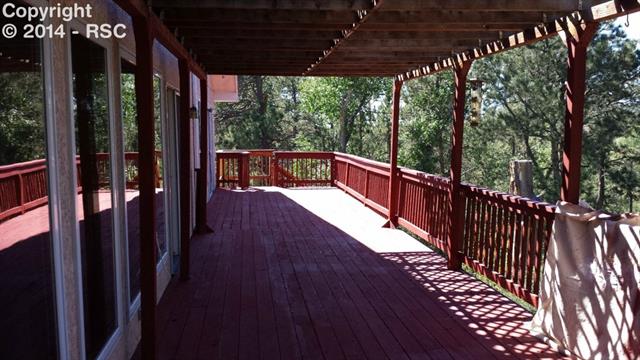7512 Tudor Road Colorado Springs, CO 80919 - Photo 16 of 17 Back of Patio that is the length of the back of the house.