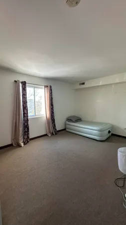 a bathroom with a sink a toilet and shower curtain
