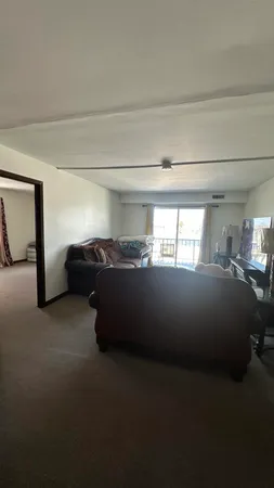 a kitchen with a sink cabinets and window