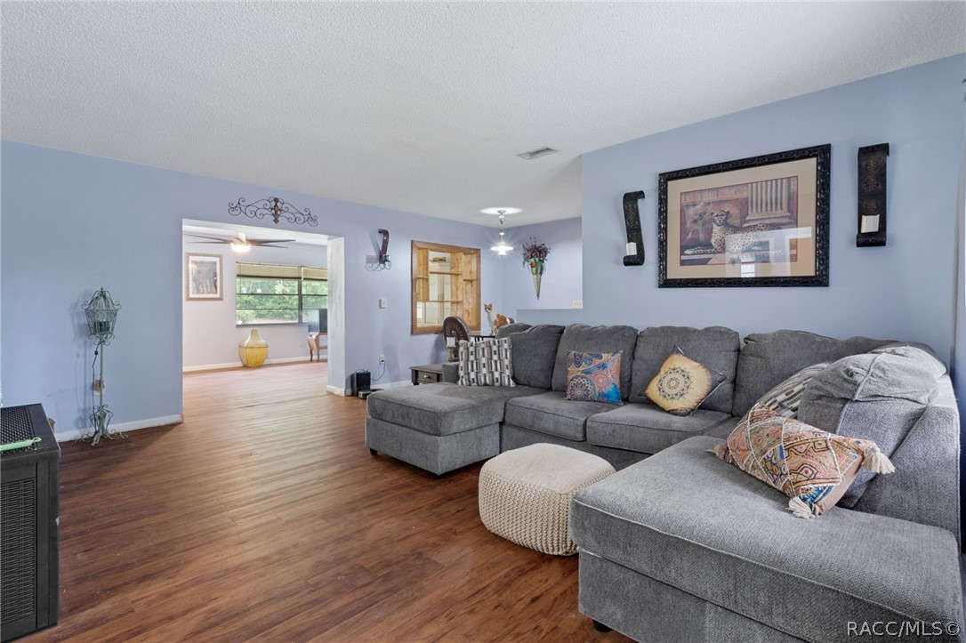 3355 South Highlands Avenue Inverness, FL 34452 - Photo 6 of 30 a living room with furniture and a wooden floor