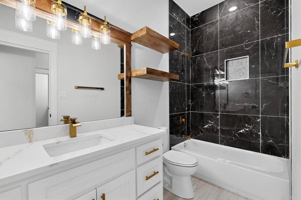 1161 Gonzollas Road Springtown, TX 76082 - Photo 18 of 40 a bathroom with a sink a toilet and shower