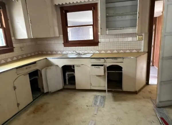 a view of a kitchen that has a sink and a stove