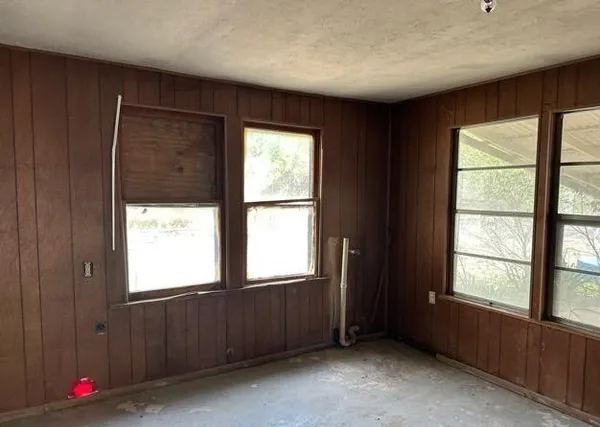 an empty room with windows